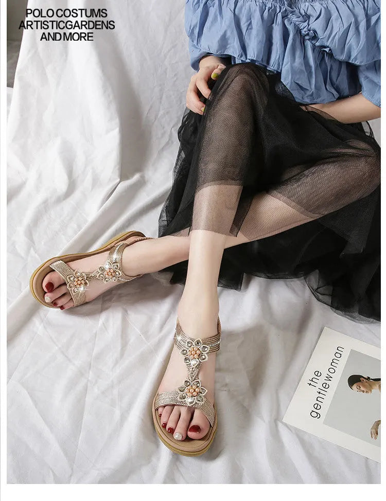 Boho flat flower rhinestone sandals in apricot with round toe and back strap on a plain background