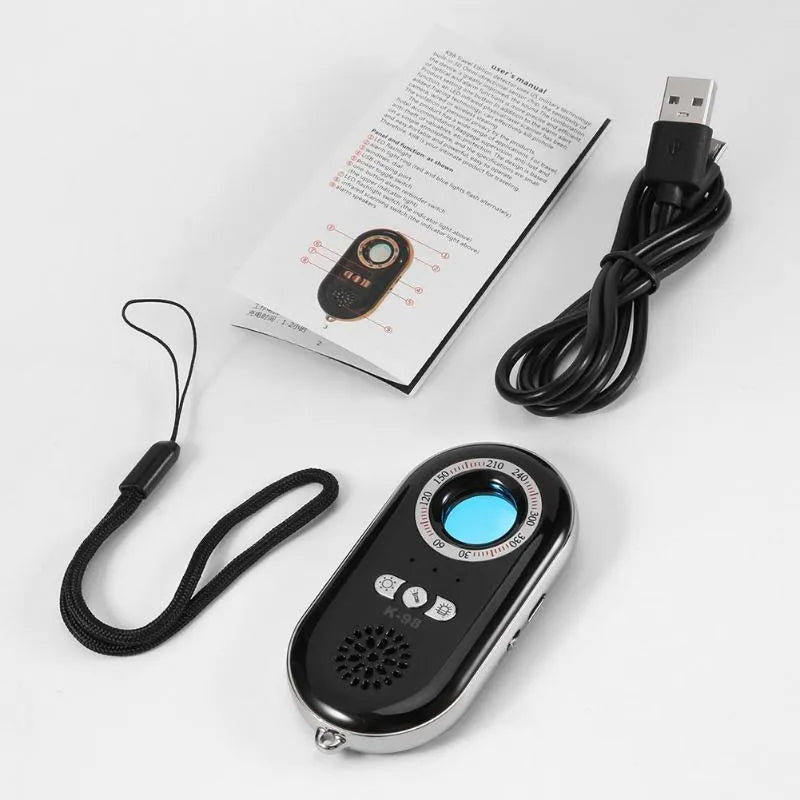 Black wireless signal detector anti-theft alarm showing compact size next to a ruler.