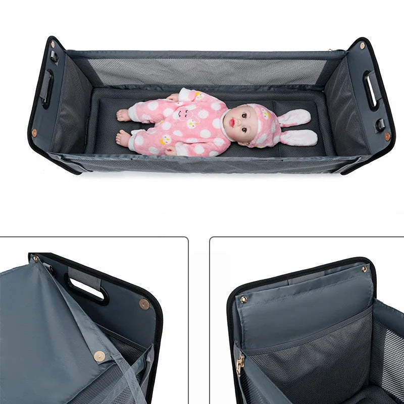 Portable baby nappy messenger bag with foldable crib, sunshade, and mosquito net