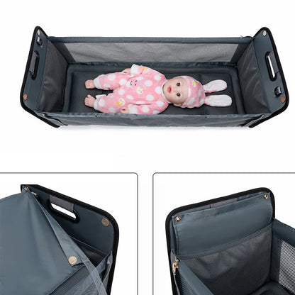 Portable baby nappy messenger bag with foldable crib, sunshade, and mosquito net