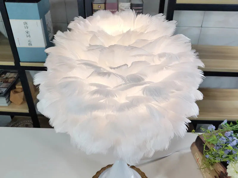 Natural white goose feather touch dimmer table lamp with metal base, grey colour, on bedside table