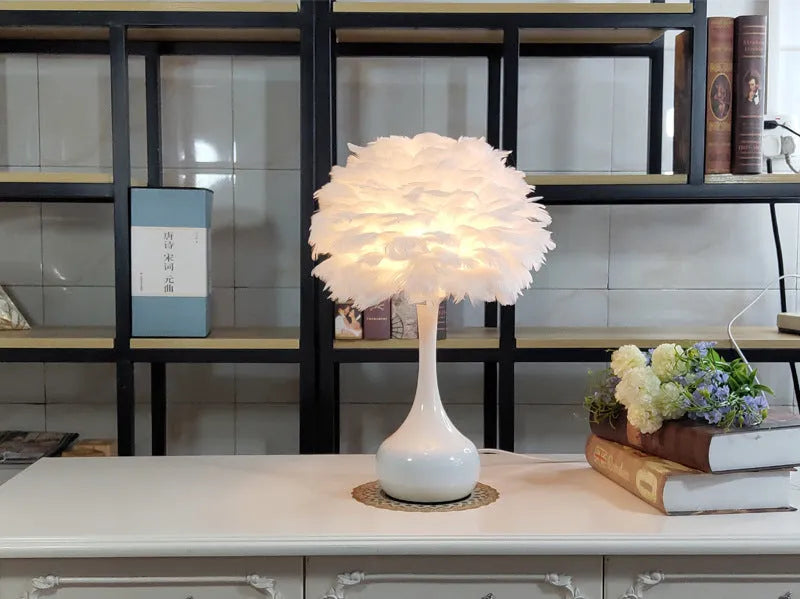 Natural white goose feather touch dimmer table lamp with metal base, grey colour, on bedside table