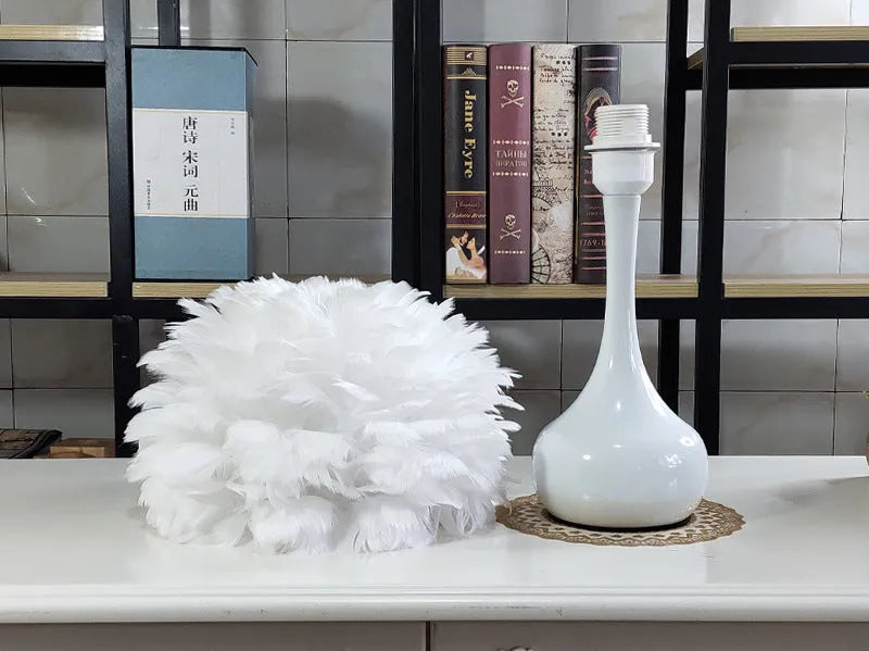 Natural white goose feather touch dimmer table lamp with metal base, grey colour, on bedside table