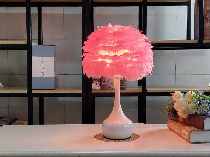 Natural white goose feather touch dimmer table lamp with metal base, grey colour, on bedside table