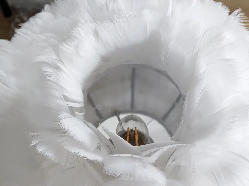 Natural white goose feather touch dimmer table lamp with metal base, grey colour, on bedside table