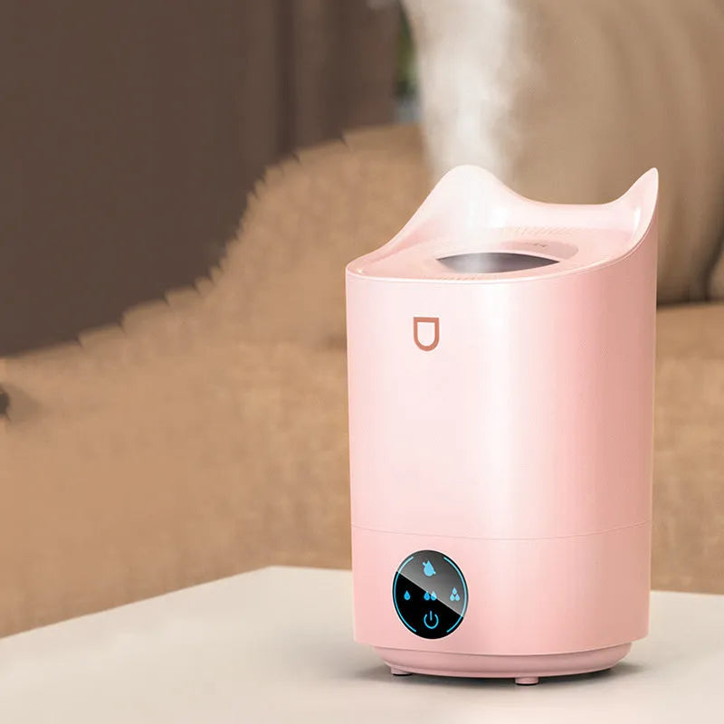 USB-powered humidifier with three mist outlets and 2.6-4.0 litre tank in Coral Pink colour