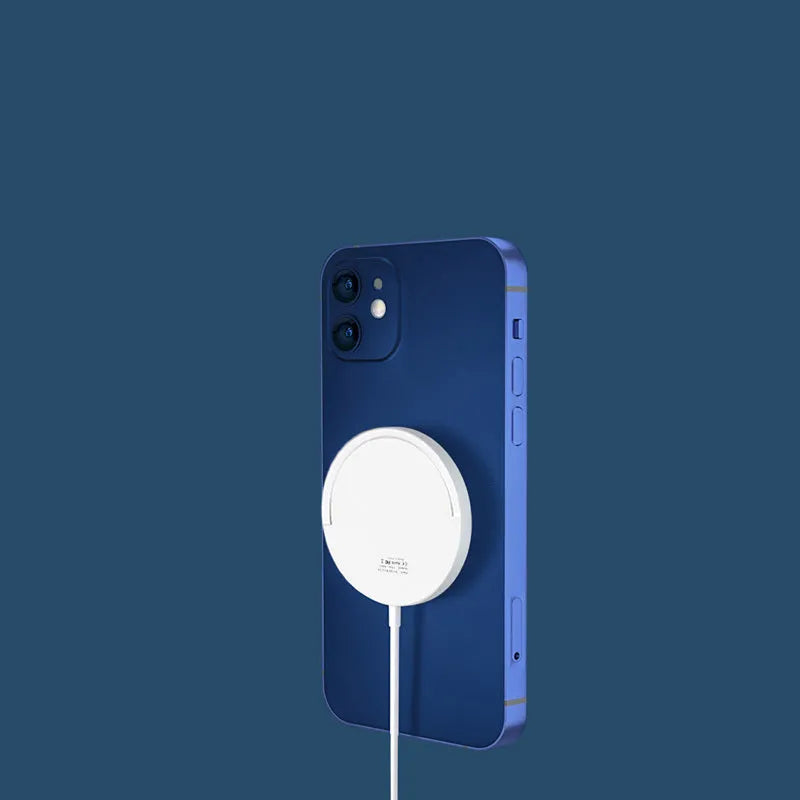 Black and white magnetic wireless phone charging bracket on a desk
