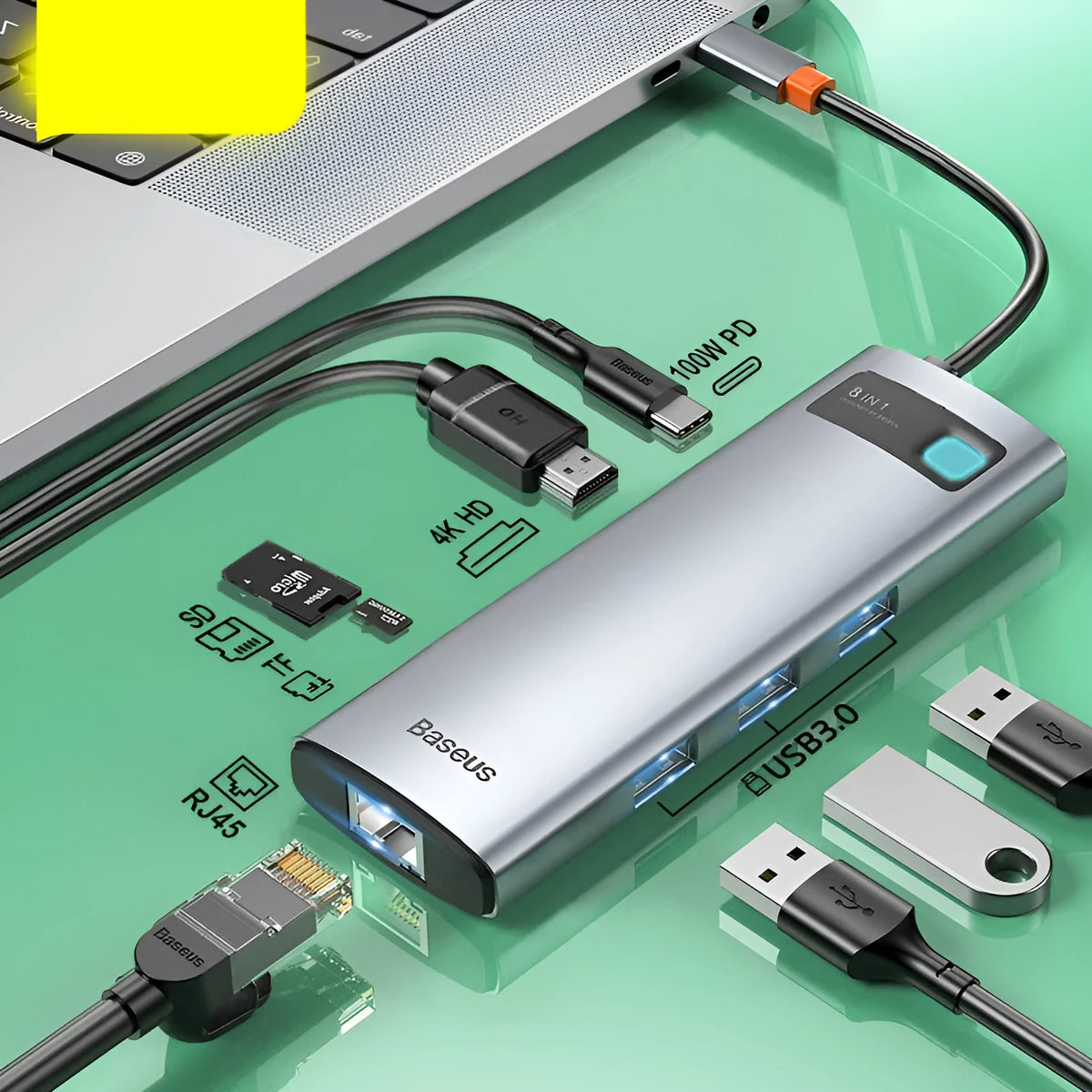 Baseus Metal Shimmer Type-C hub with multiple ports including USB 3.0, HDMI, and Ethernet on a desk next to a laptop