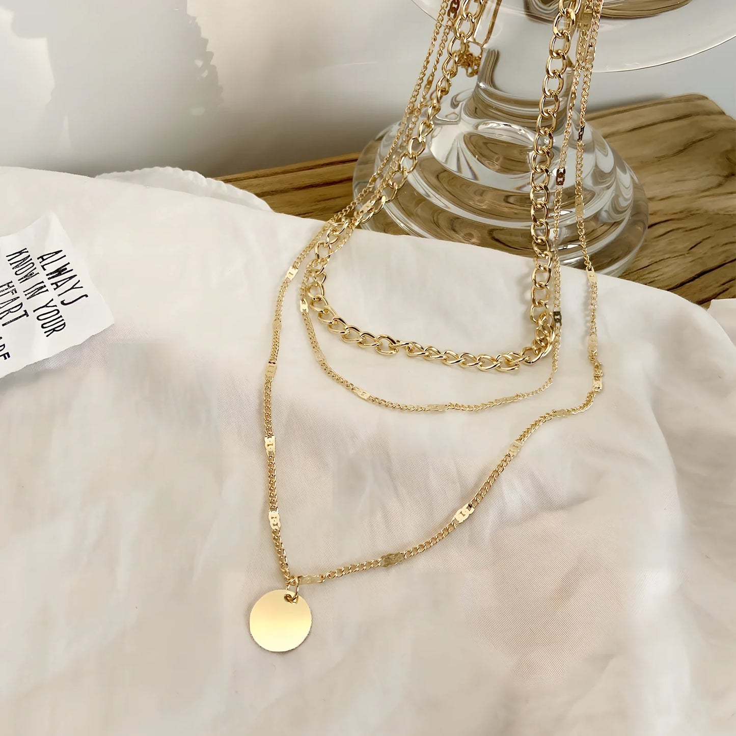 Women's multilayer alloy necklace with 2.5 cm disc pendant on 40-50 cm electroplated chains in gold or silver