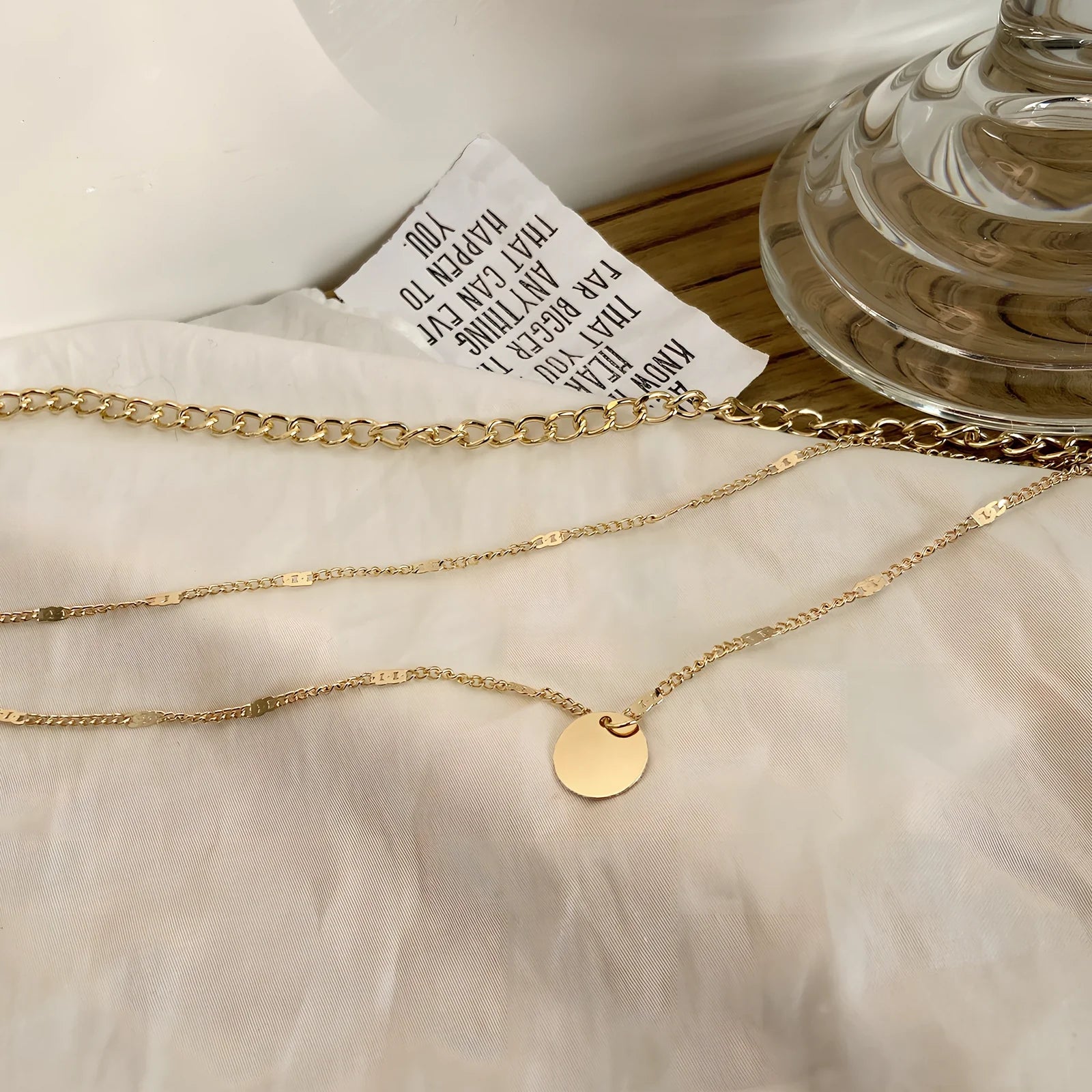 Women's multilayer alloy necklace with 2.5 cm disc pendant on 40-50 cm electroplated chains in gold or silver