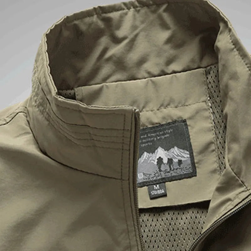 Men's outdoor leisure vest with stand-up collar and front zipper in khaki, shown on a model against a plain background