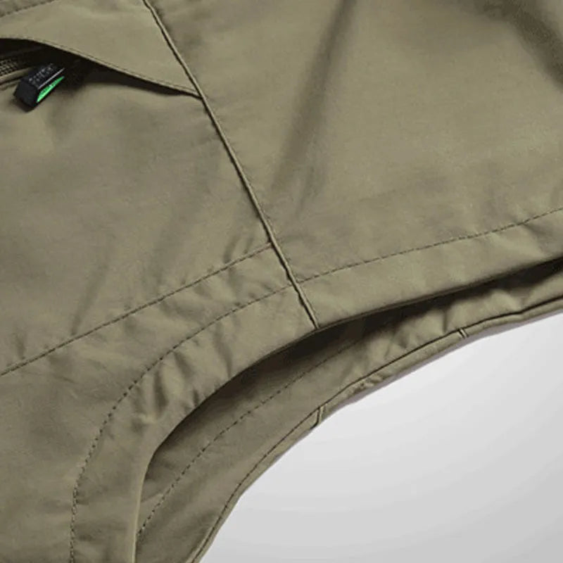 Men's outdoor leisure vest with stand-up collar and front zipper in khaki, shown on a model against a plain background