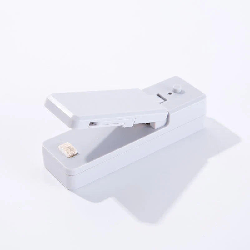 Portable ABS mini snack packaging bag heat sealing machine in white grey