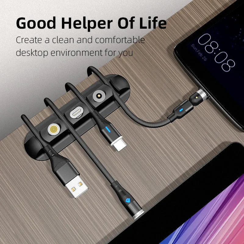 Black soft plastic desktop organiser for holding and organising charging and data cables.