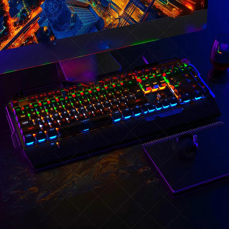 Silver Carving K100 metal mechanical keyboard with black axis keys, seven-color backlight, large hand rest, and phone holder on a desk