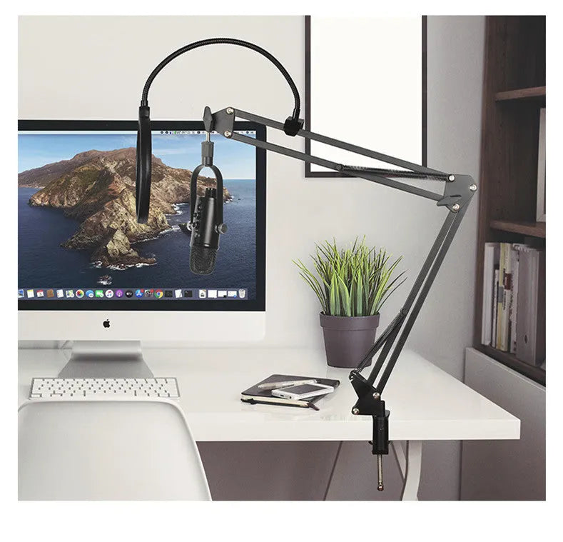 Black JIY BM-86PRO USB condenser microphone on a metal stand with a sponge cover attached.