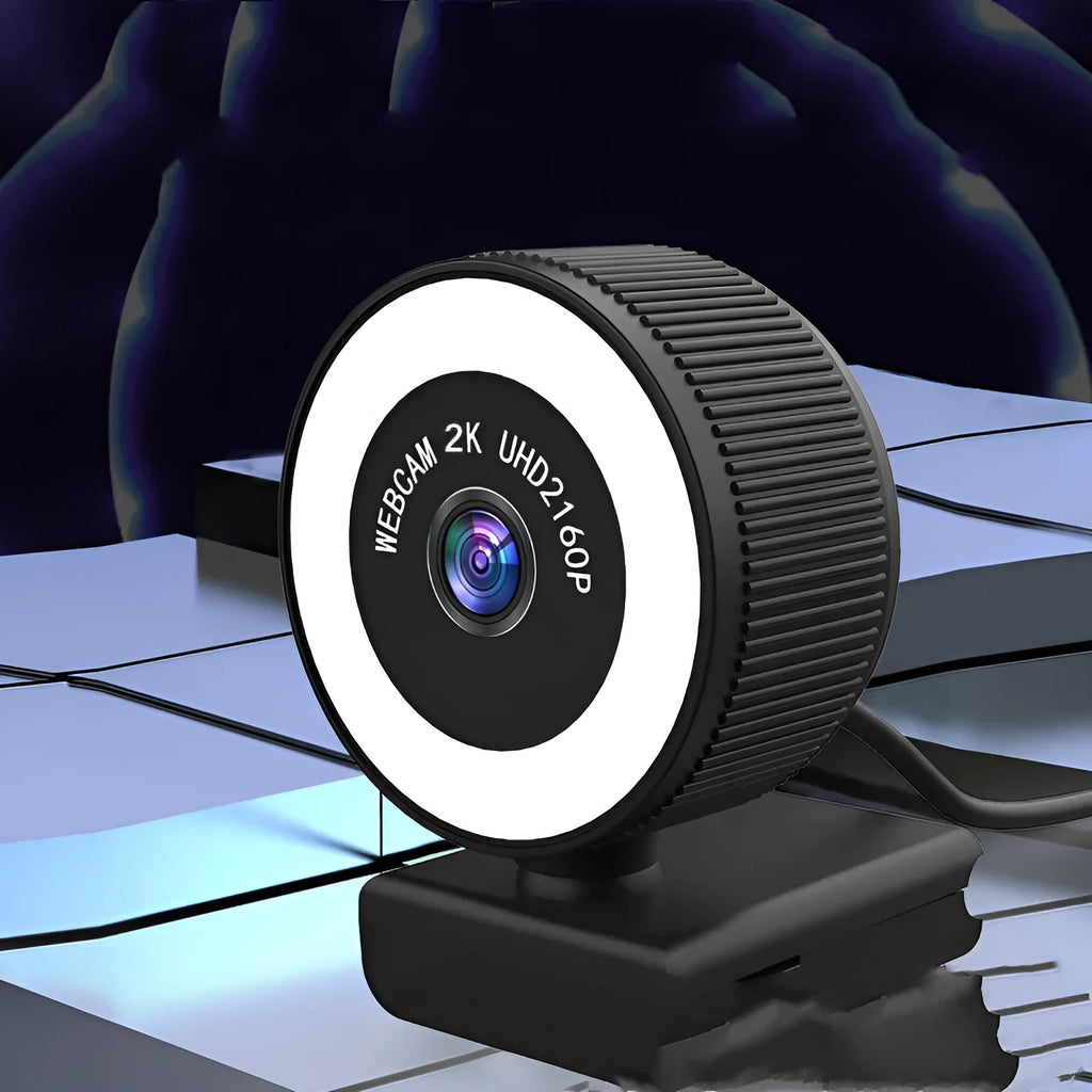 USB webcam 1080p 2K HD camera with built-in microphone and privacy cover on a desktop setup