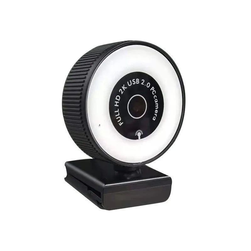 USB webcam 1080p 2K HD camera with built-in microphone and privacy cover on a desktop setup