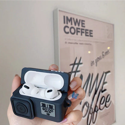 Black silicone AirPods case with flip-top design and carabiner hook attachment