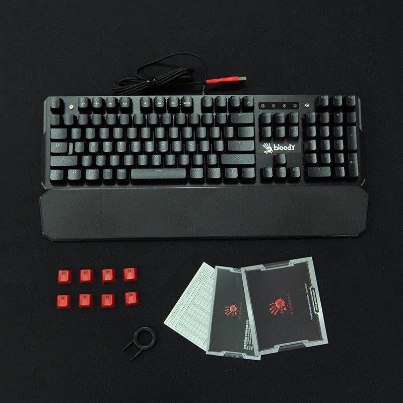 Optical axis mechanical keyboard with green switches, 104 keys, seven-colour backlight, metal body, and wrist rest on a desk