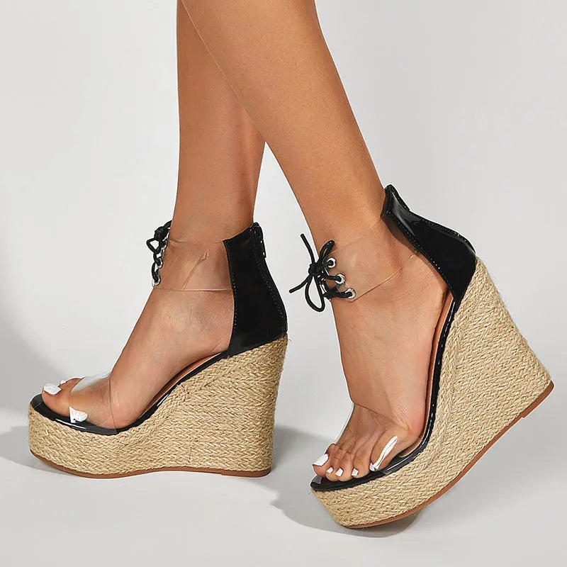 Black women's wedge sandals with hemp rope detail on the upper and a high platform sole.