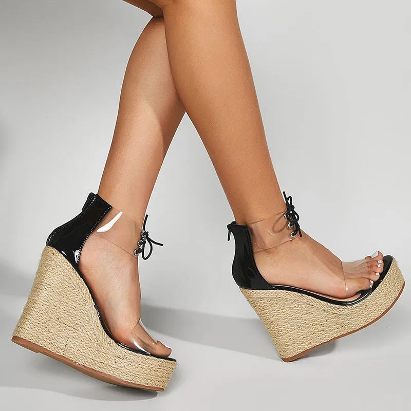 Black women's wedge sandals with hemp rope detail on the upper and a high platform sole.