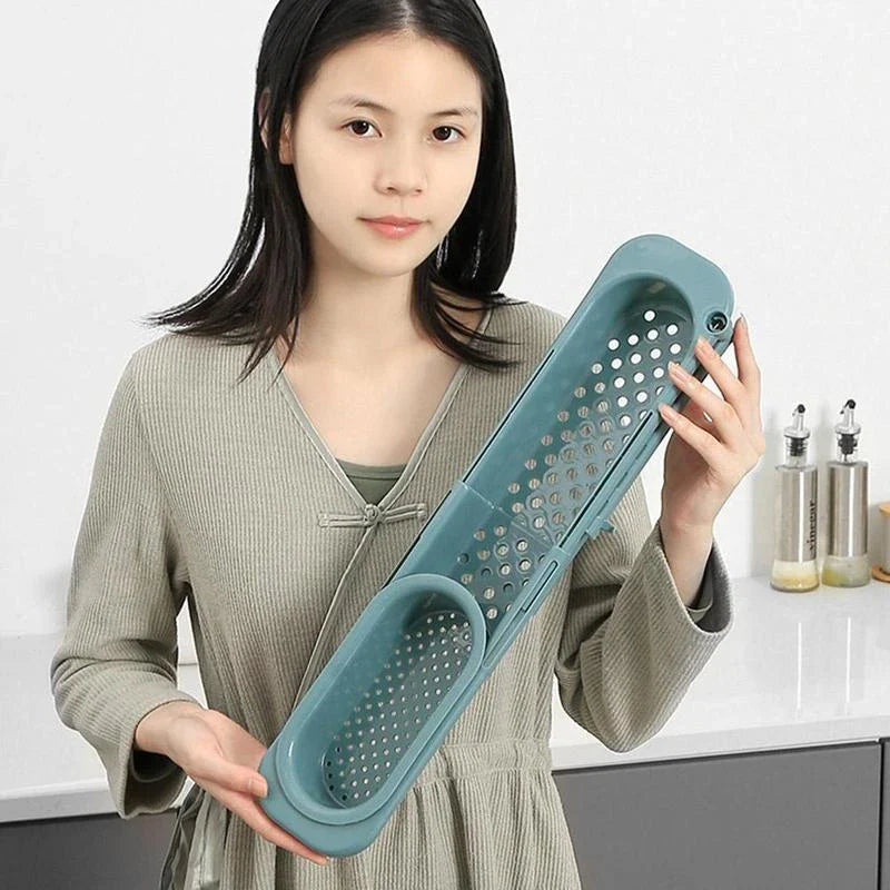 Adjustable sink caddy with storage compartments and drainage system for organizing kitchen sinks