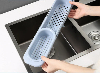 Adjustable sink caddy with storage compartments and drainage system for organizing kitchen sinks