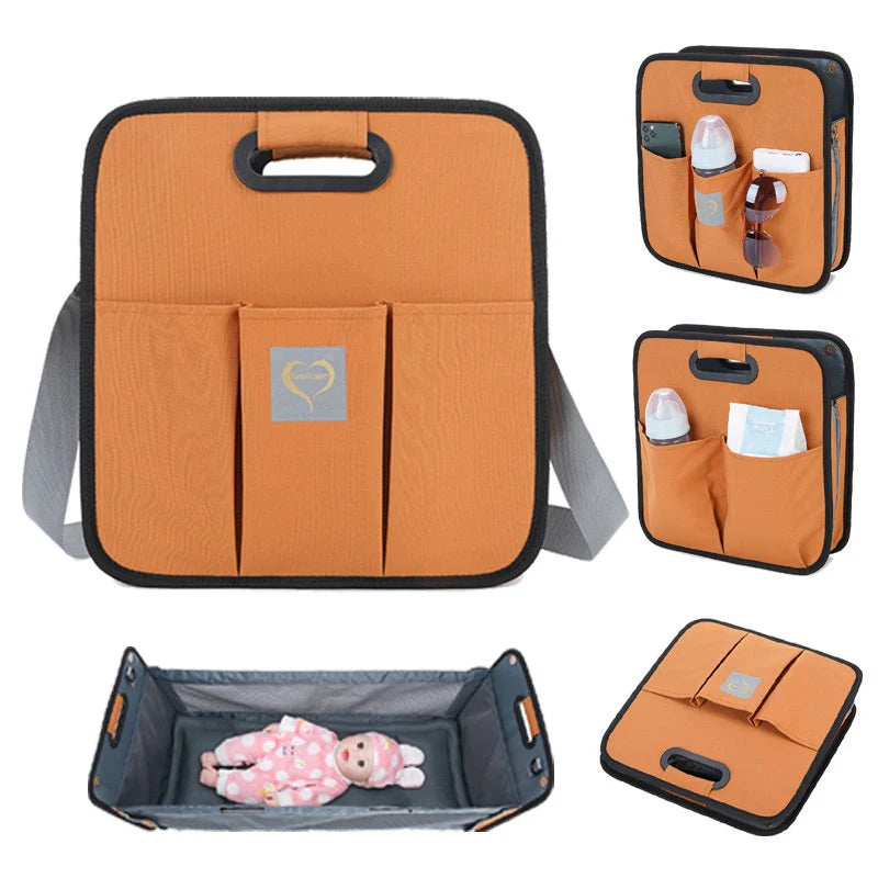 Portable baby nappy messenger bag with foldable crib, sunshade, and mosquito net