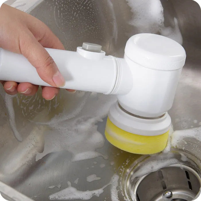 White electric cleaning brush with three interchangeable brush heads for household surfaces