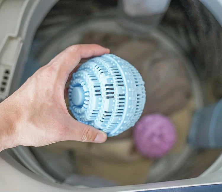 Laundry ball in blue, pink, white, and green for effective clothes cleaning
