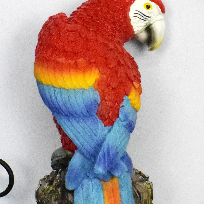 Hand-painted resin parrot solar light with LED glow for garden decoration, available in red blue yellow