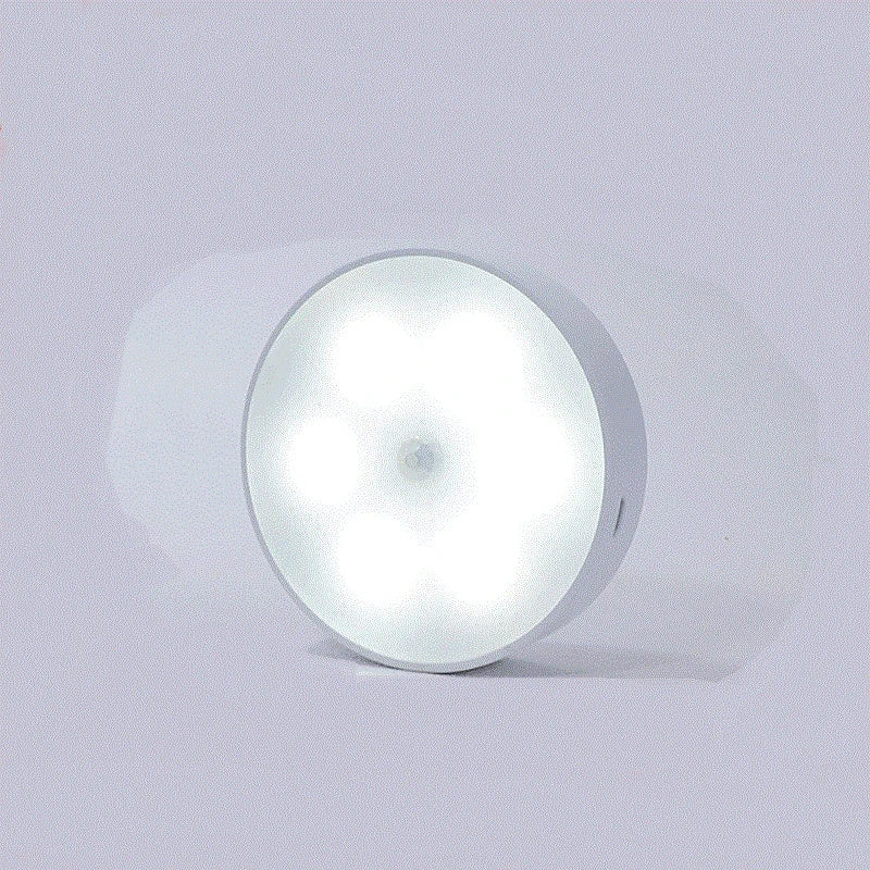 USB rechargeable motion sensor LED puck light for cabinets and night use