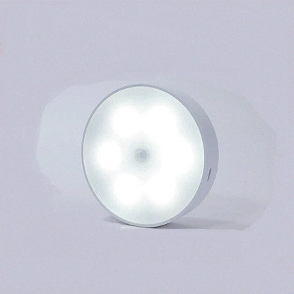 USB rechargeable motion sensor LED puck light for cabinets and night use
