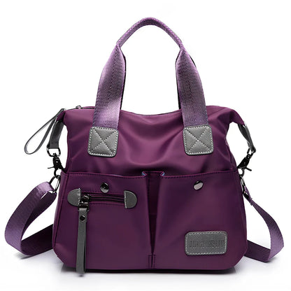 Ladies shoulder bag in black Oxford fabric, size M with multiple pockets and adjustable straps for handbag or crossbody carry, 340 mm width