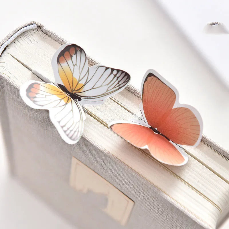 Butterfly paper bookmark with random colours measuring 13.5cm by 5.5cm