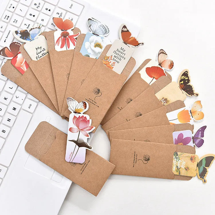 Butterfly paper bookmark with random colours measuring 13.5cm by 5.5cm