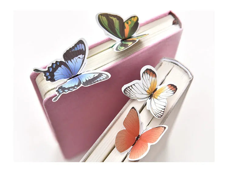 Butterfly paper bookmark with random colours measuring 13.5cm by 5.5cm