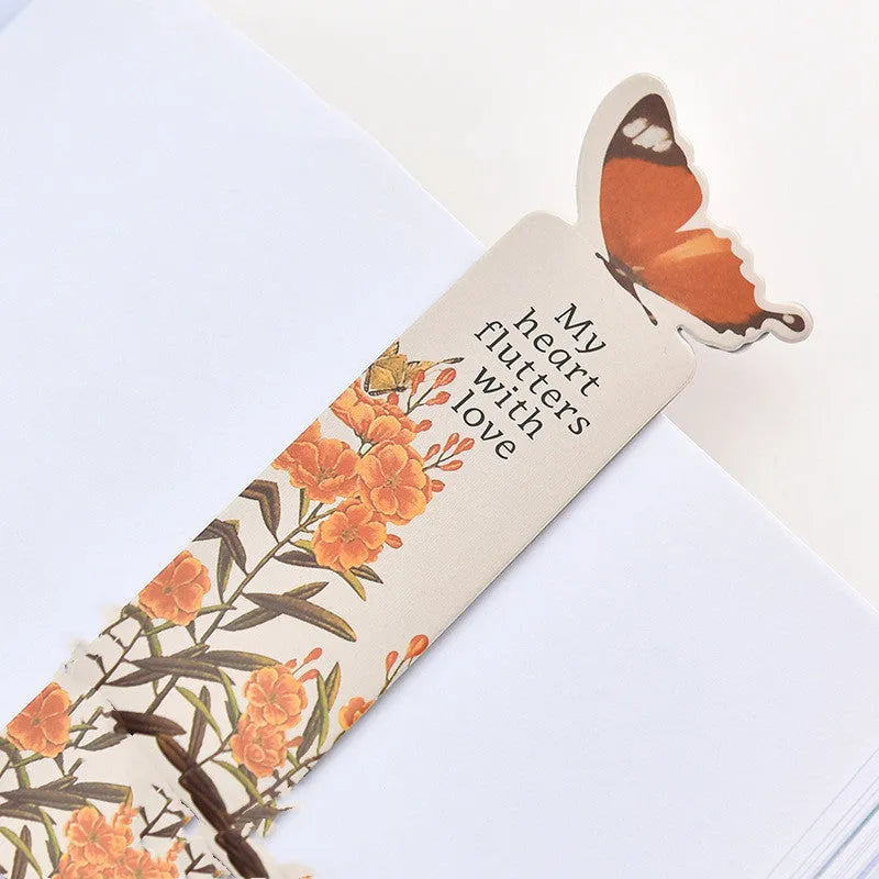 Butterfly paper bookmark with random colours measuring 13.5cm by 5.5cm