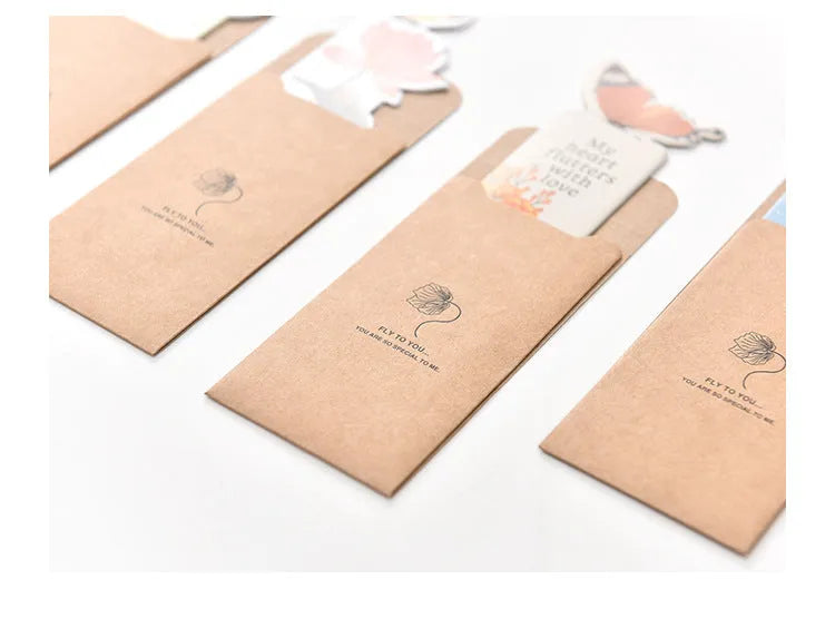 Butterfly paper bookmark with random colours measuring 13.5cm by 5.5cm