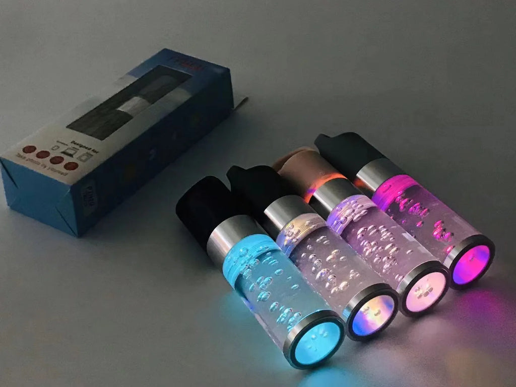 Colourful cartoon crystal light portable Bluetooth speaker in pink, showing compact size.