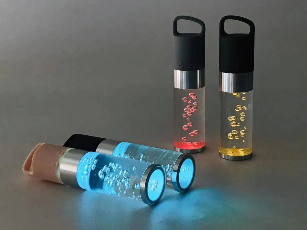 Colourful cartoon crystal light portable Bluetooth speaker in pink, showing compact size.