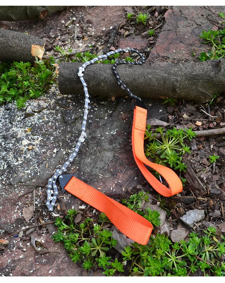 Manganese steel manual wire saw with black portable handle on natural ground