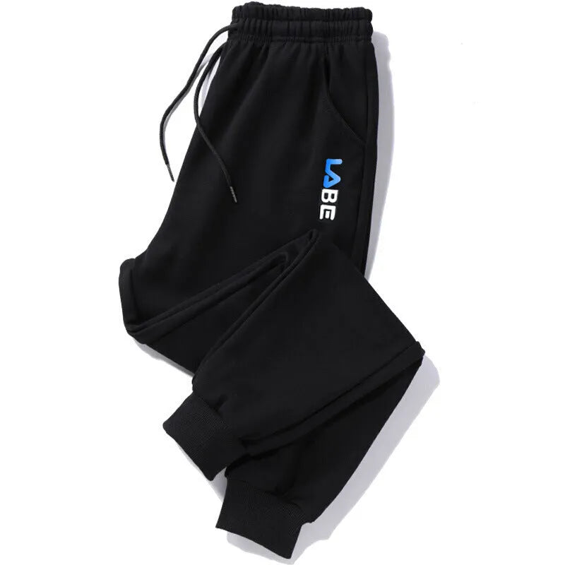 Loose fit nine-length casual trousers in Alphabet Blue, side view showing small-foot hem and tether closure