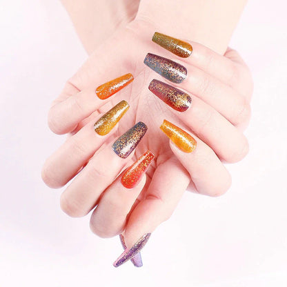 Ballet gradient glitter false nails with trapezoidal shape showing glitter density variation from cuticle to tip