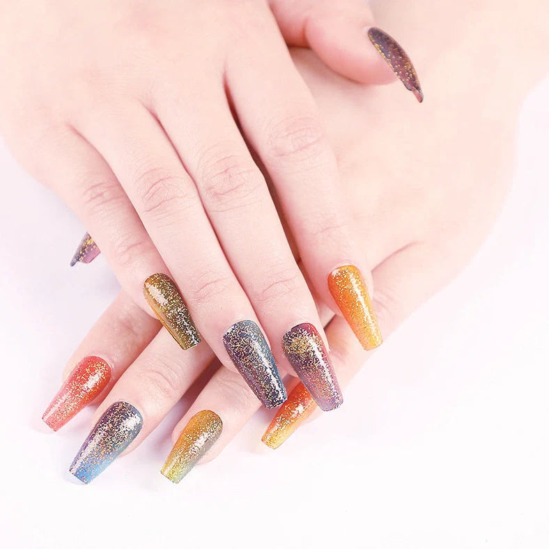 Ballet gradient glitter false nails with trapezoidal shape showing glitter density variation from cuticle to tip