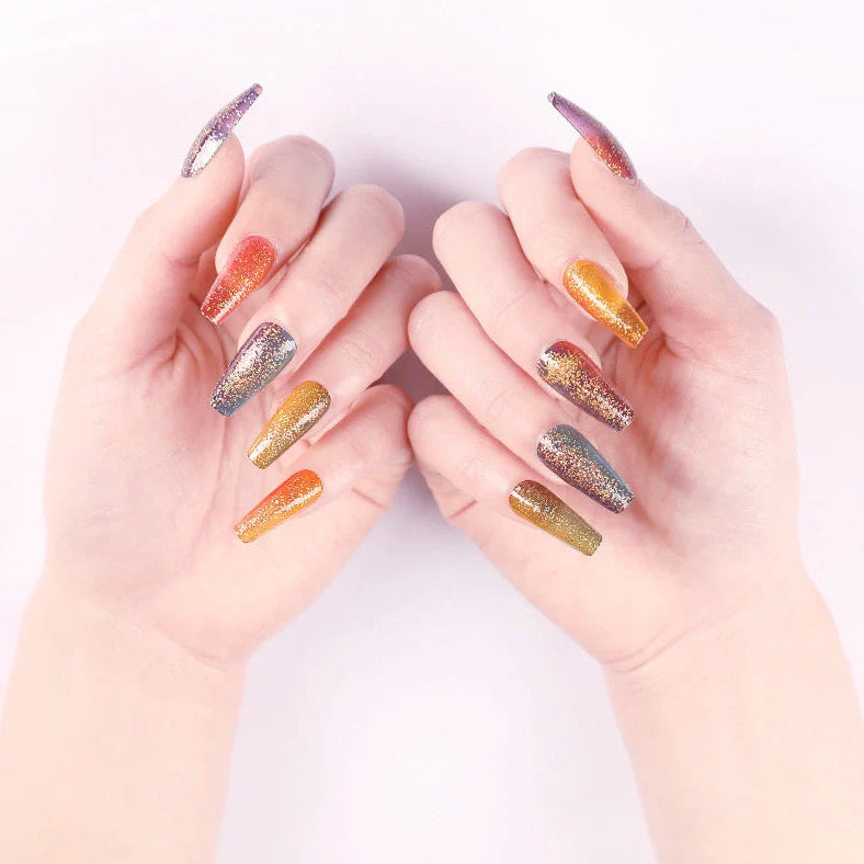 Ballet gradient glitter false nails with trapezoidal shape showing glitter density variation from cuticle to tip