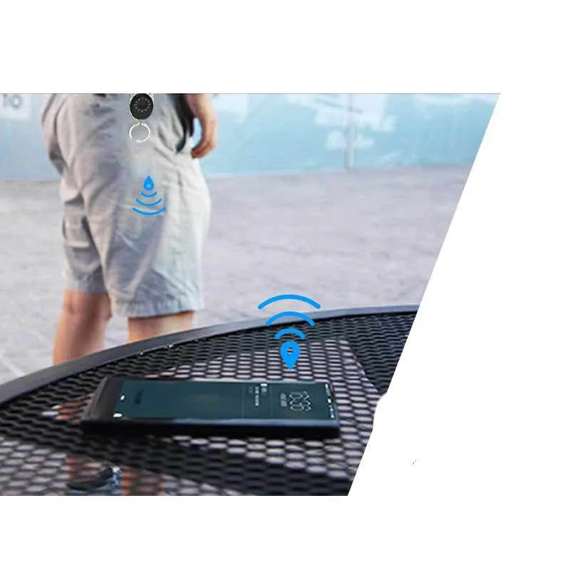 Black Bluetooth anti-lost tracker keychain compatible with Apple Find My network on a metal key ring