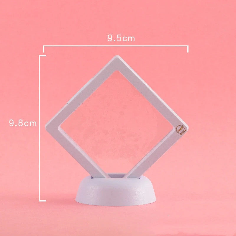 3D floating jewelry display stand showcasing earrings and coins in mid-air