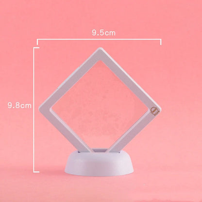 3D floating jewelry display stand showcasing earrings and coins in mid-air